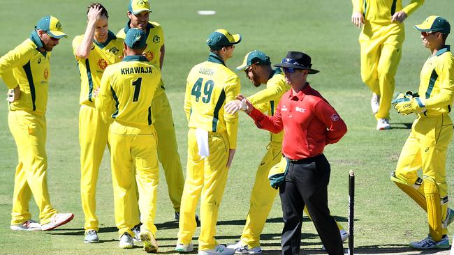 Steve Smith is congratulated by team-mates after taking a wonder catch during a World Cup practice match between Australia and New Zealand. Picture: Bradley Kanaris/Getty Images