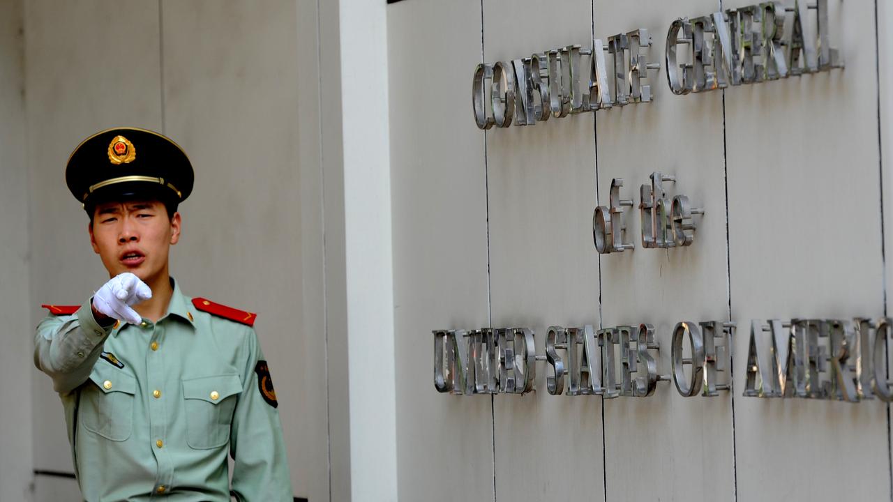 A Chinese police officer at the entrance to the US consulate in Chengdu, southwest China'. Picture: GOH Chai Hin / AFP.