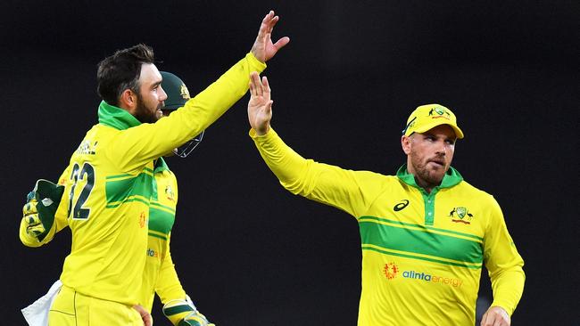 Glenn Maxwell (L) celebrates a wicket with Aaron Finch. Picture: Getty