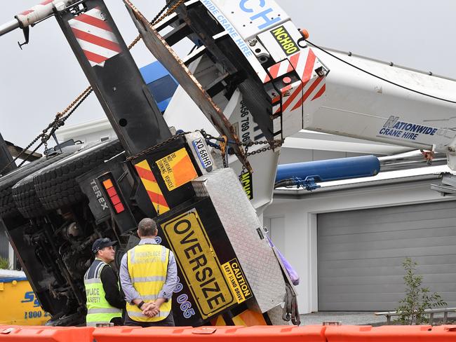 Three houses were damaged when a crane toppled over at Nirimba on Friday afternoon. Picture: Patrick Woods.