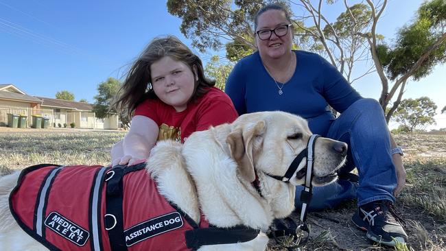 Murrianna Reese and her son Logan with his assistance dog Hunter. Picture: Dylan Hogarth