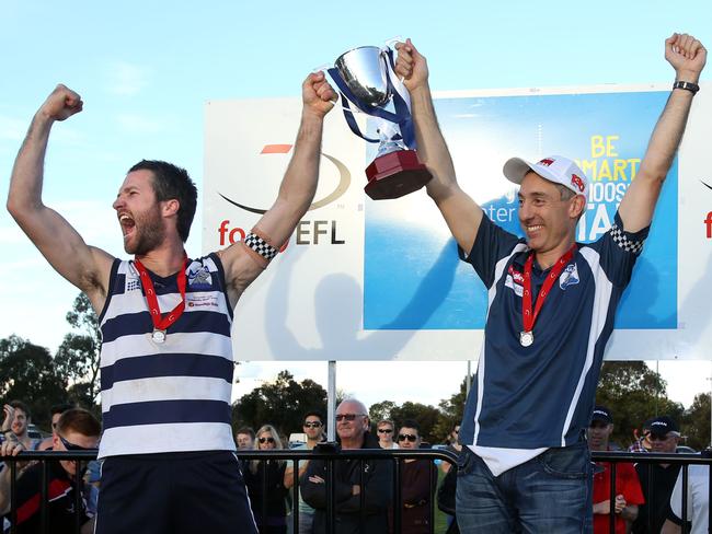 Andrew Tranquilli hoists the 2013 Division 3 premiership with captain Luke Parker. Picture: Stuart Milligan