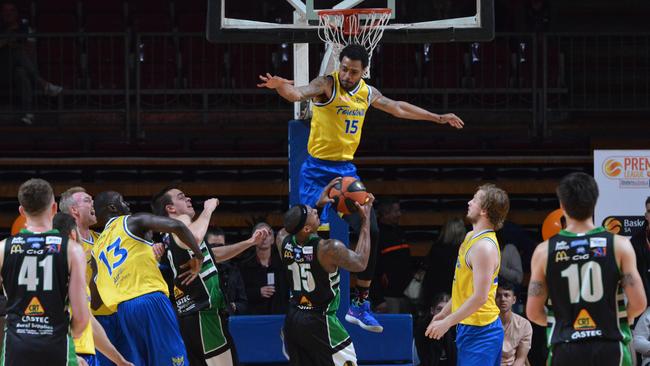 Forestville US import Greg Mays defends while Mount Gambier’s US import Kentrell Barkley goes for goal during the men’s basketball Premier League grand final. Picture: AAP/Brenton Edwards