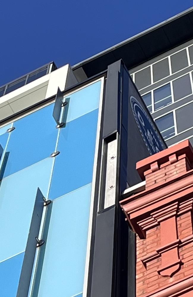 A metal panel (R) has come off the Myer building on Liverpool St in Hobart's CBD. It is not confirmed whether one of the metal decorative pieces has also come off. Tasmania Police have closed Liverpool St between Criterion and Murray St due to high winds.