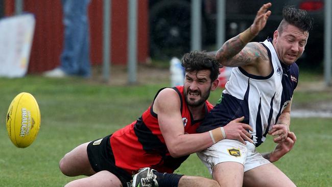 Romsey’s Nathan Rayment takes down Melton Centrals’ Shane Frederickson in the RDFL last weekend. Photo: Mark Wilson