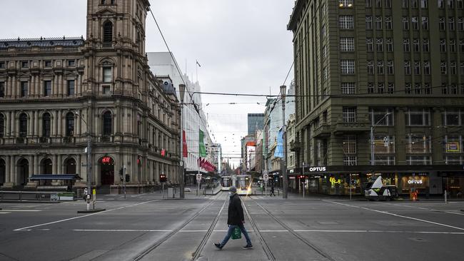 A person crosses Bourke Street in Melbourne on Tuesday. Picture: Getty Images