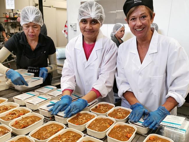 Janel Horton (right) from Gourmet Dinner Service + Dietlicious where staff are working frantically to meet demand. Picture: Supplied