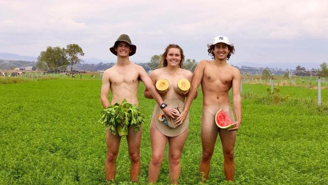 The naked farmers are allowed strategically placed props.