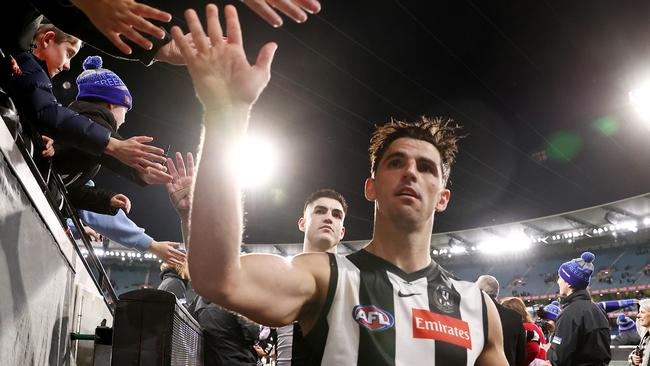 It’s high-fives all round for Collingwood at the moment. But Scott Pendlebury’s side still needs a few more wins yet to feature in September. Picture: Michael Klein