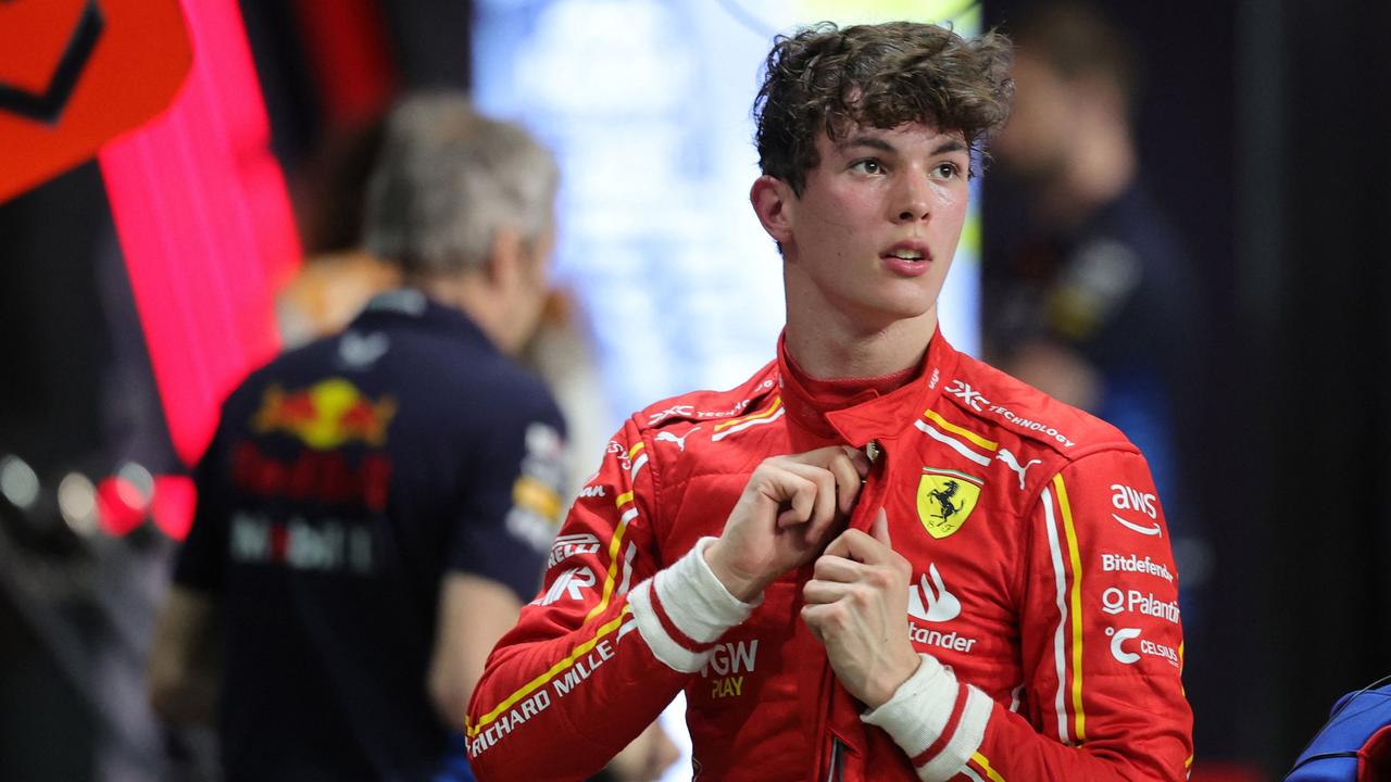 Ferrari's British reserve driver Oliver Bearman stands the garage after the qualifying session.