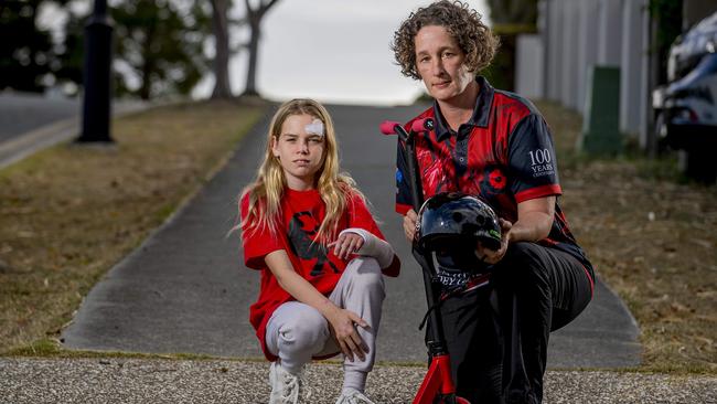 Year 7 student Chloe Uttley, pictured with mum Anna, fell off her scooter during a high-speed accident, but doctors said the fact she was wearing a helmet probably saved her life. Picture: Jerad Williams