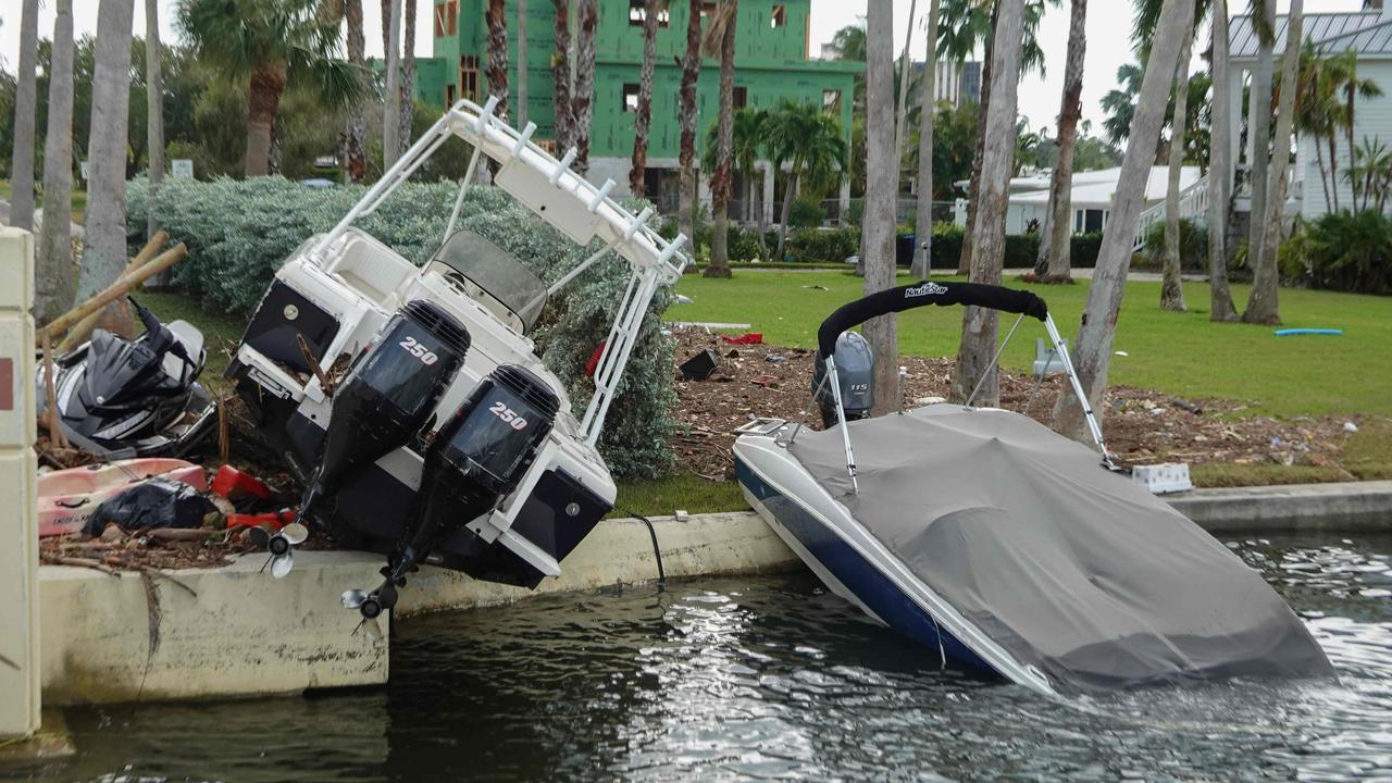 Damaged boats sit on shore after high surge waters hit the coastline in Florida. Picture: Joe Raedle/Getty Images/AFP