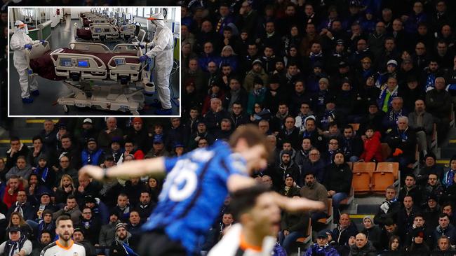 Main picture: Fans at the Atalanta-Valencia Champions League game at the San Siro stadium on February 19. Inset: Nurses prepare an intensive care unit in Italy