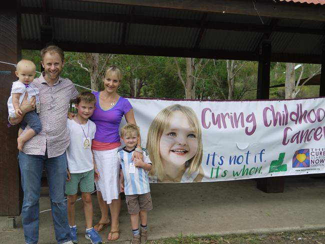 The Rogers family at the charity walk raising funds for brain cancer research. Pictured from left: Jackson Rogers holding their youngest daughter Georgia, Atticus, mum Mary Ellen, and Rufus.