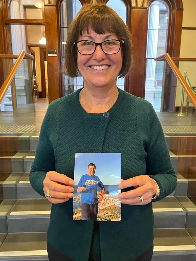 Andrea Fuller with a photo of her father Dion Manthorpe, a retired country GP who died peacefully aged 95 surrounded by his five children, sipping Grange, assisted by the VAD laws. Picture: Supplied by family