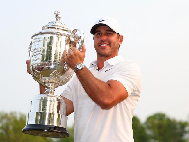 ROCHESTER, NEW YORK - MAY 21: Brooks Koepka of the United States celebrates with the Wanamaker Trophy after winning the 2023 PGA Championship at Oak Hill Country Club on May 21, 2023 in Rochester, New York.   Andrew Redington/Getty Images/AFP (Photo by Andrew Redington / GETTY IMAGES NORTH AMERICA / Getty Images via AFP)