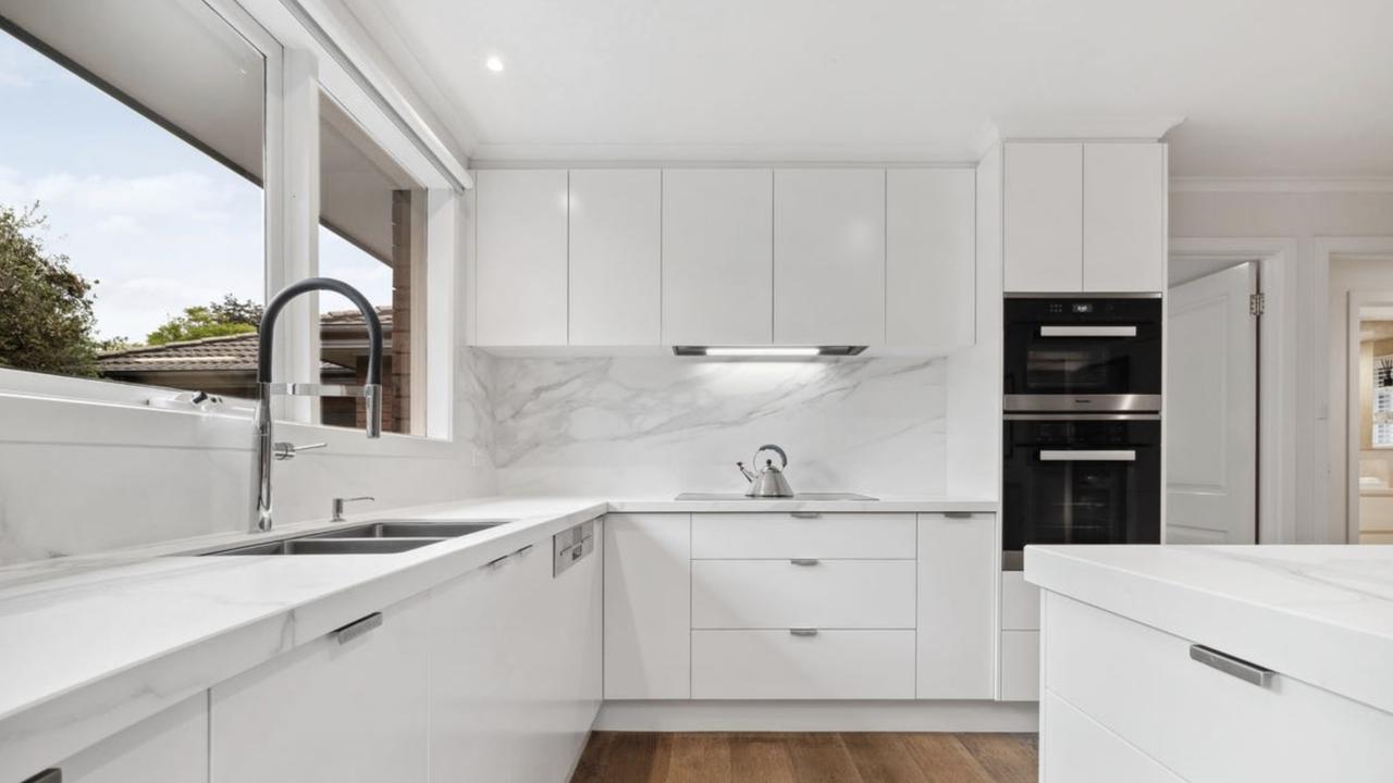 The Miele kitchen is a showstopper for buyers, with travertine floors, stone benchtops and room for Nonna or Yiayia-level cooking sessions.