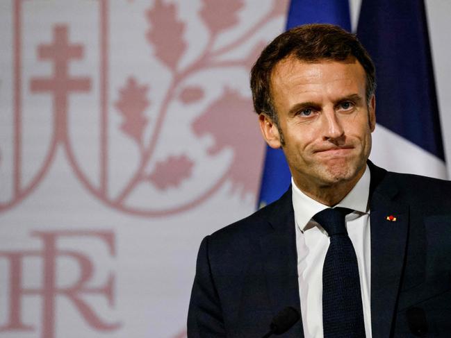 French President Emmanuel Macron looks on as delivers a speech during a meeting with French nationals living in Thailand at the Peninsula hotel in Bangkok on november 17, 2022, as he visits Thailand for the APEC Summit. (Photo by Ludovic MARIN / AFP)