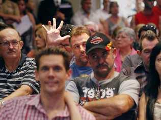 Keith Evans from Camira bids on a property during the Ray White Mega Auction at the Springfield Lakes Hotel on Saturday (240312). . Picture: Claudia Baxter