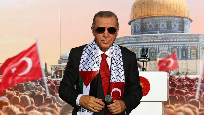 Turkish President Tayyip Erdogan, wearing a scarf with the Palestinian and Turkish flags during a rally organised by the AKP party in solidarity with the Palestinians in Gaza, in Istanbul on October 28, 2023. Picture: AFP