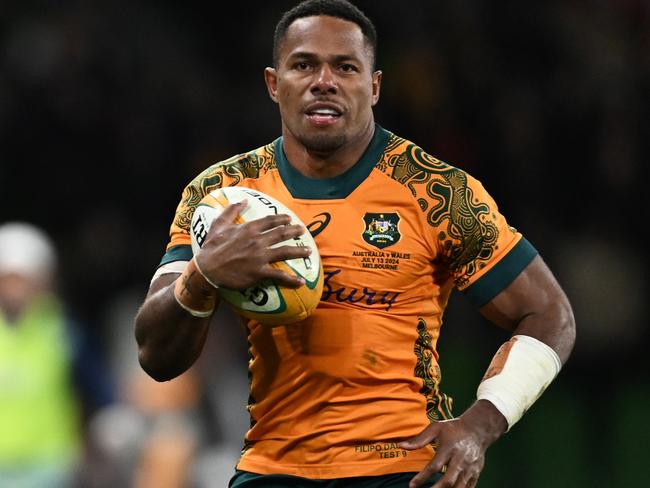 MELBOURNE, AUSTRALIA - JULY 13: Filipo Daugunu of the Wallabies runs in to score a try during the International Test Match between Australia Wallabies and Wales at AAMI Park on July 13, 2024 in Melbourne, Australia. (Photo by Daniel Pockett/Getty Images)