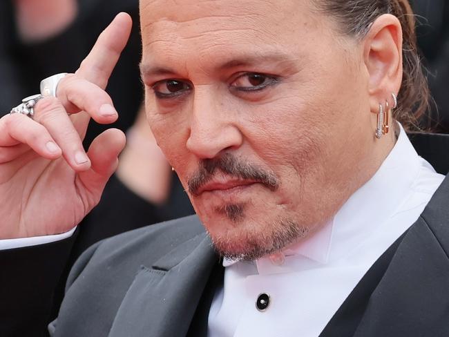 CANNES, FRANCE - MAY 16: Johnny Depp and MaÃÂ¯wenn attend the "Jeanne du Barry" Screening & opening ceremony red carpet at the 76th annual Cannes film festival at Palais des Festivals on May 16, 2023 in Cannes, France. (Photo by Victor Boyko/Getty Images)