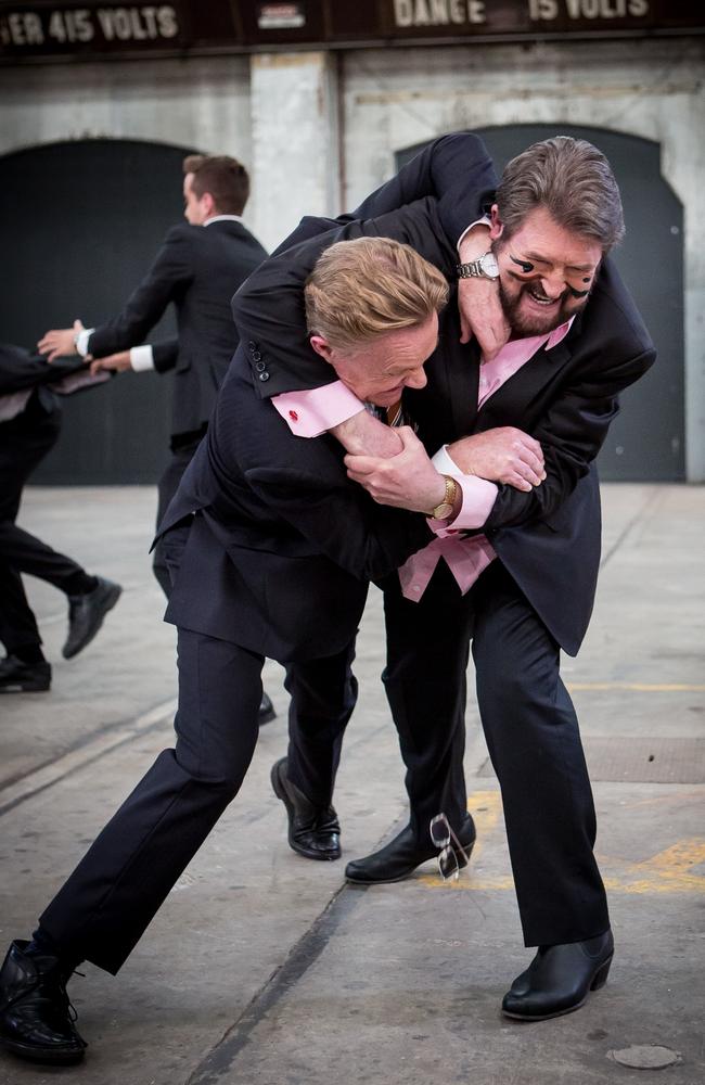 Vicious brawl ... Derryn Hinch gets Hugh Riminton in a headlock as part of a newsreader death match. Picture: Supplied