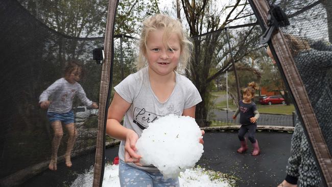 Coffs is no stranger to hail. Residents and emergency services will recall the October 21, 2021 when hail ravaged Sawtell and Toormina just after 2pm. Pictured – Toormina children Amiyah 7, Destiny 4, Harley 6, Melikah 6, Hunter 5, have some fun with chunks of hail on Graff Ave. Picture: Frank Redward