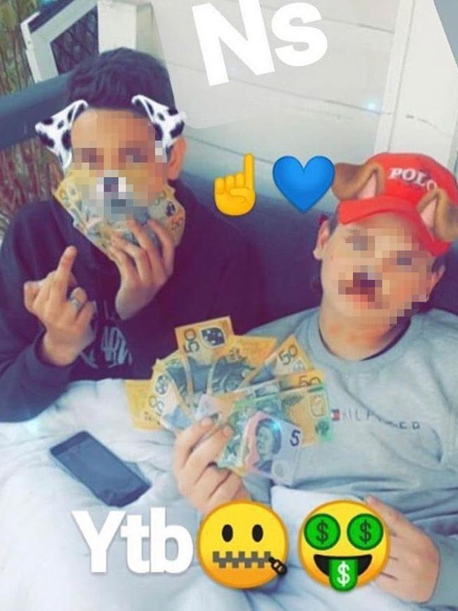 Two young teens with piles of money on the Northside Gang Instagram page YTB stands for “Yeah, the boys”. Picture: Instagram