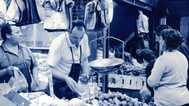 Customers waiting to buy fresh fruit.