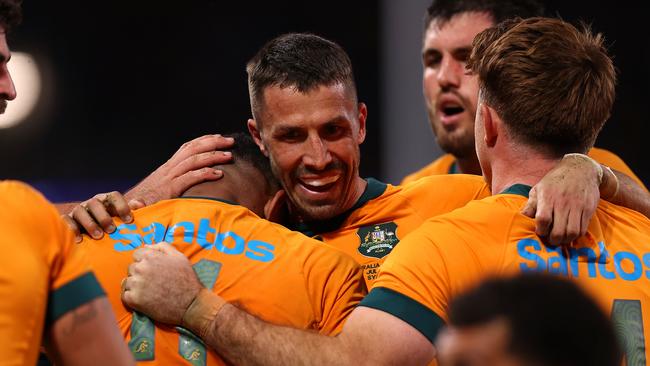 SYDNEY, AUSTRALIA - JULY 06: Filipo Daugunu of the Wallabies celebrates with team mates after scoring a try during the men's International Test match between Australia Wallabies and Wales at Allianz Stadium on July 06, 2024 in Sydney, Australia. (Photo by Jason McCawley/Getty Images)