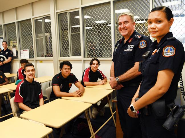 Casuarina Senior College students Jaiman Bruce, Kurt McCurry-Parriman and Colin Wilson with school based constable Constable Nicolette Krepapas and Acting Commissioner Michael Murphy.