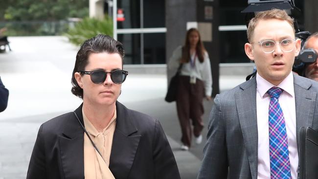 Ms O’Brien (left) leaves court in the company of her defence team after Ms Wallis was committed to stand trial for murdering Constable Masters. Photo NewsWire / Scott Powick