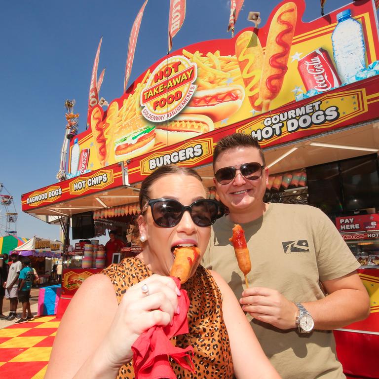 Sarah Smith and Ryan Roswell get into the Dagwood Dogs. Picture GLENN CAMPBELL