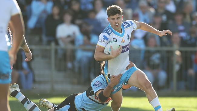 Toby Sexton of the Titans is tackled during the round 15 NRL match between the Cronulla Sharks and the Gold Coast Titans at, on June 18, 2022, in Coffs Harbour, Australia. (Photo by Mark Kolbe/Getty Images)