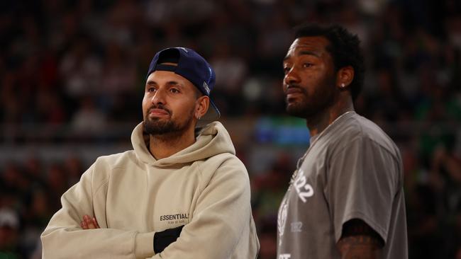 Nick Kyrgios, seen here with NBA player John Wall in Melbourne, has barely been seen on a tennis court this year. (Photo by Graham Denholm/Getty Images)