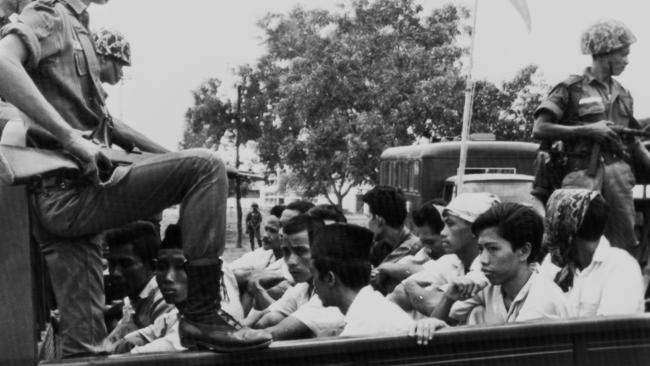 Members of the Youth Wing of the Indonesian Communist Party are taken to prison in Jakarta in 1965.