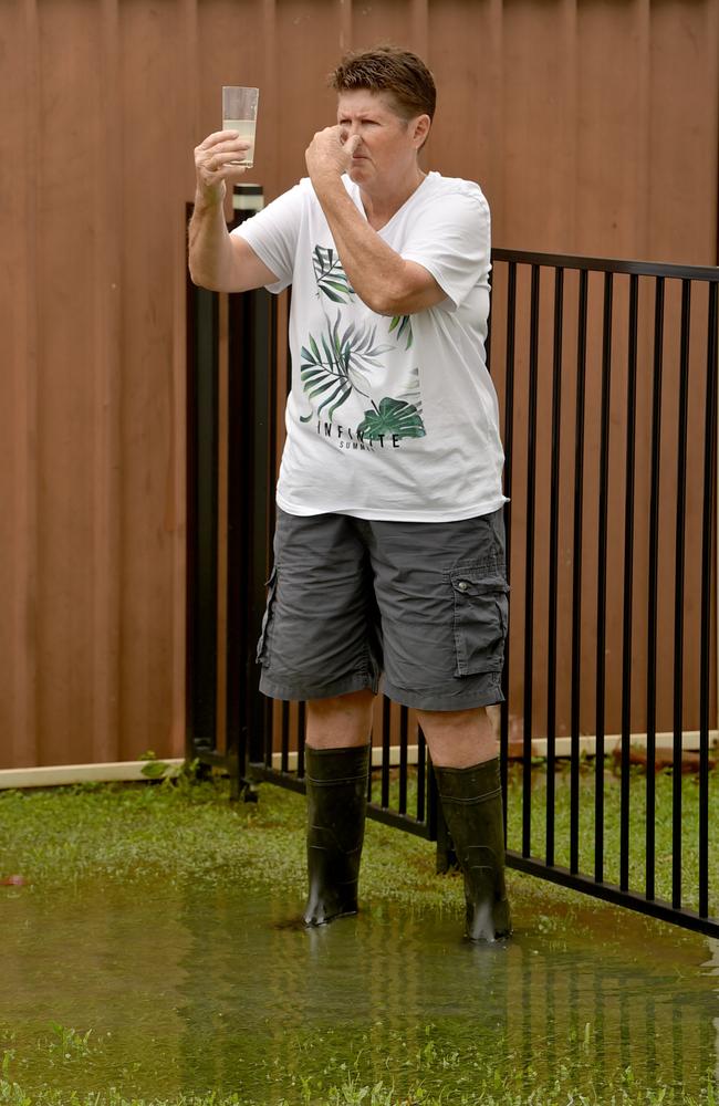 Leanne Dobbin, standing in sewage in her backyard during a previous ‘poonami’. Picture: Evan Morgan