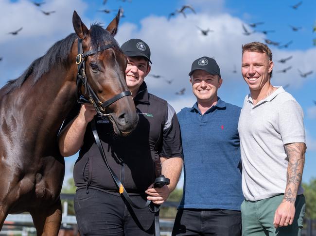 Mr Brightside with Co Trainer Ben Hayes,  Western Bulldogs footballer, James Harmes, and Strapper Will Evans at Lindsay Park Stables on Flemington Racecourse on March 15, 2024 in Flemington, Australia. (Photo by Jay Town/Racing Photos via Getty Images)