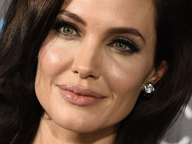 FILE - In this Jan. 15, 2015 file photo, Angelina Jolie arrives at the 20th annual Critics' Choice Movie Awards at the Hollywood Palladium, in Los Angeles. Jolie is teaming up with Netflix to direct an adaptation of “First They Killed My Father: A Daughter of Cambodia Remembers.” In an interview Jolie said, 
