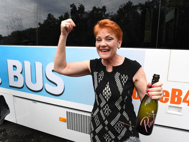 One Nation leader Pauline Hanson pops the bubbly to launch her ‘Battler Bus’ in Brisbane yesterday. Picture: Dave Hunt/AAP