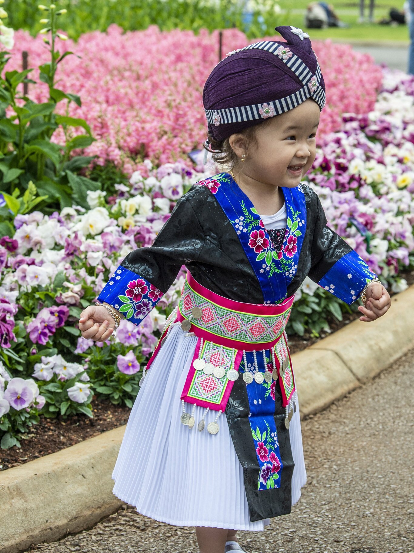 Two year old Chee Lee wears traditional Hmong dress