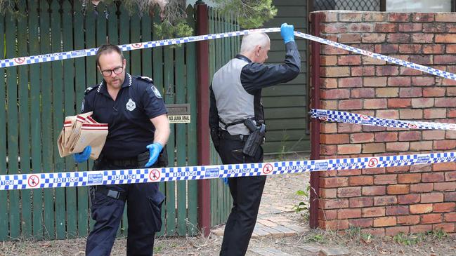 Police officers leave the home in Sunray Street, Sunnybank Hills. Picture: Peter Wallis