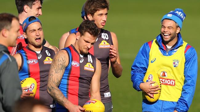 Jason Johannisen of the Bulldogs (right), laughs during training at Whitten Oval.