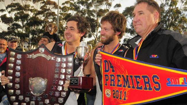 Billy Parks with Corey Pressler and Jamie Thomas after Kilburn's 2015 grand final win. Picture: News Corp.