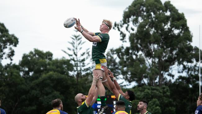 Cal Hope soars in a line out. Photo courtesy of Holly Hope Creative.