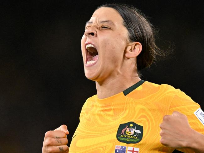 FILES-- This file photo taken on August 16, 2023 shows Australia's forward Sam Kerr celebrating scoring her team's first goal during the Australia and New Zealand 2023 Women's World Cup semi-final football match between Australia and England at Stadium Australia in Sydney. Chelsea and Australian women's football star Sam Kerr has been charged with a "racially aggravated offence" in Britain following a dispute involving a police officer, London's Metropolitan Police said March 4. The 30-year-old striker, one of the highest profile and best-paid players in the women's game, was charged following an incident in London in January 2023, a police statement read. (Photo by IZHAR KHAN / AFP)