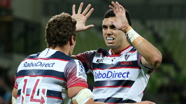 Jack Debreczeni celebrates a try with Tom English.