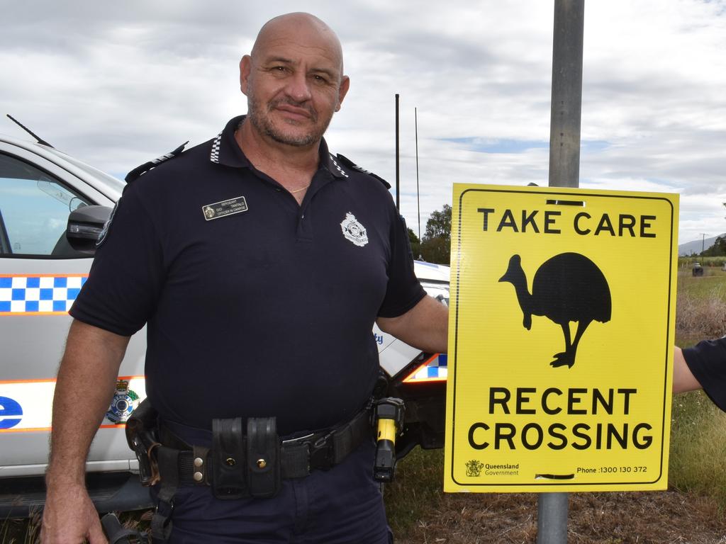 Senior Sergeant Gio Tantalo next to one of two cassowary “recent crossing” signs erected by Queensland Parks and Wildlife Service on either side of the Anabranch Bridge, Lower Herbert, Hinchinbrook. Picture: Cameron Bates