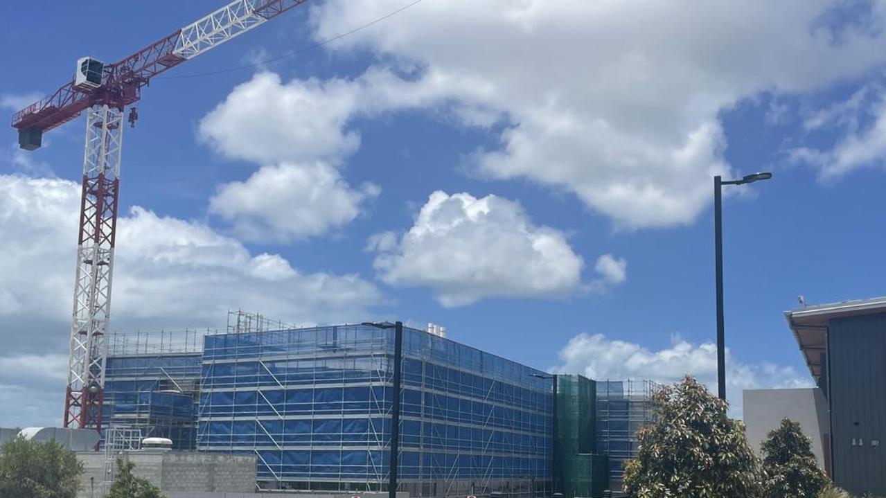 A massive crane can be seen next to scaffolding at Hervey Bay hospital where upgrades are underway.